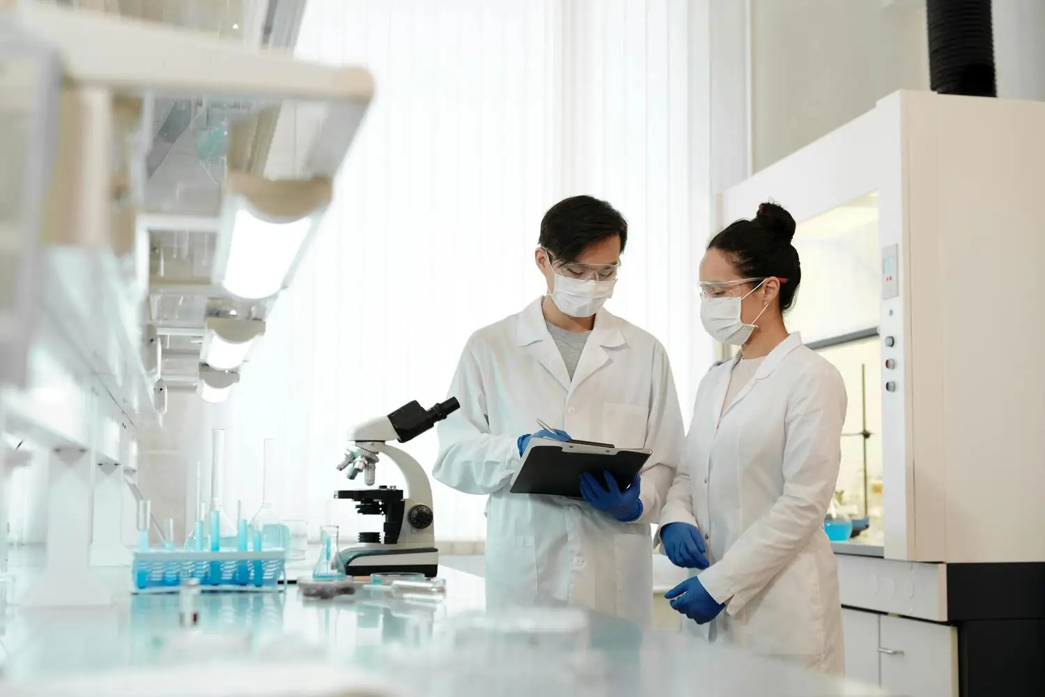 Scientists reviewing research notes in a lab